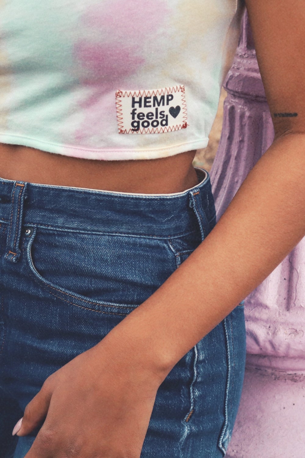 The Ana Tie-Dye crop top featuring a unique black and white tie-dye pattern, made from hemp and organic cotton, displayed on a model.