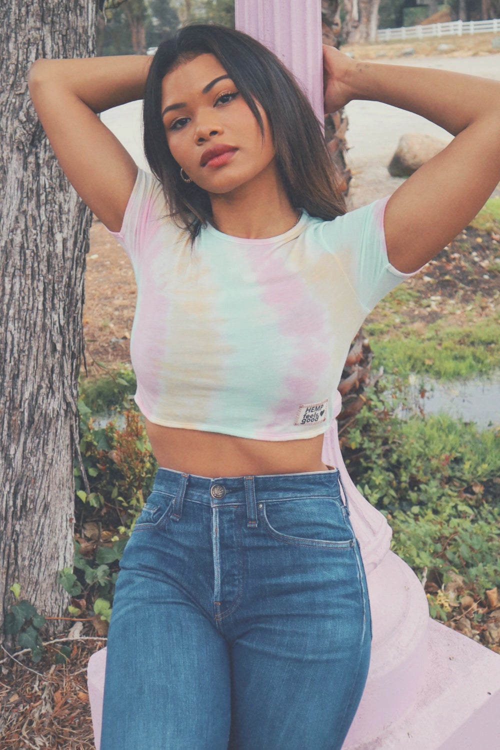 The Ana Tie-Dye crop top featuring a unique black and white tie-dye pattern, made from hemp and organic cotton, displayed on a model.