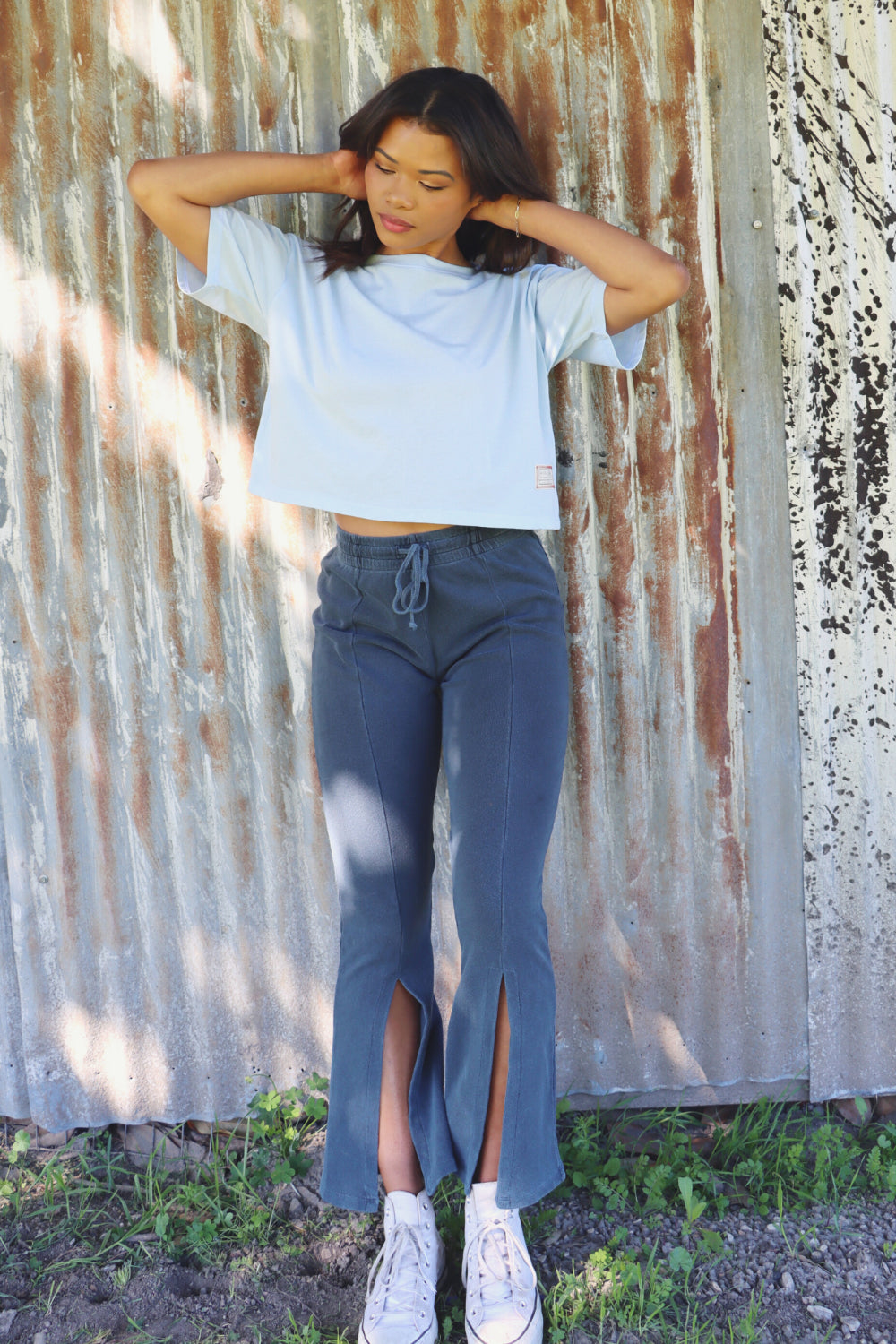 A lightweight boxy cropped t-shirt in Sky Blue and Apricot, showcasing its relaxed fit and eco-friendly fabric.