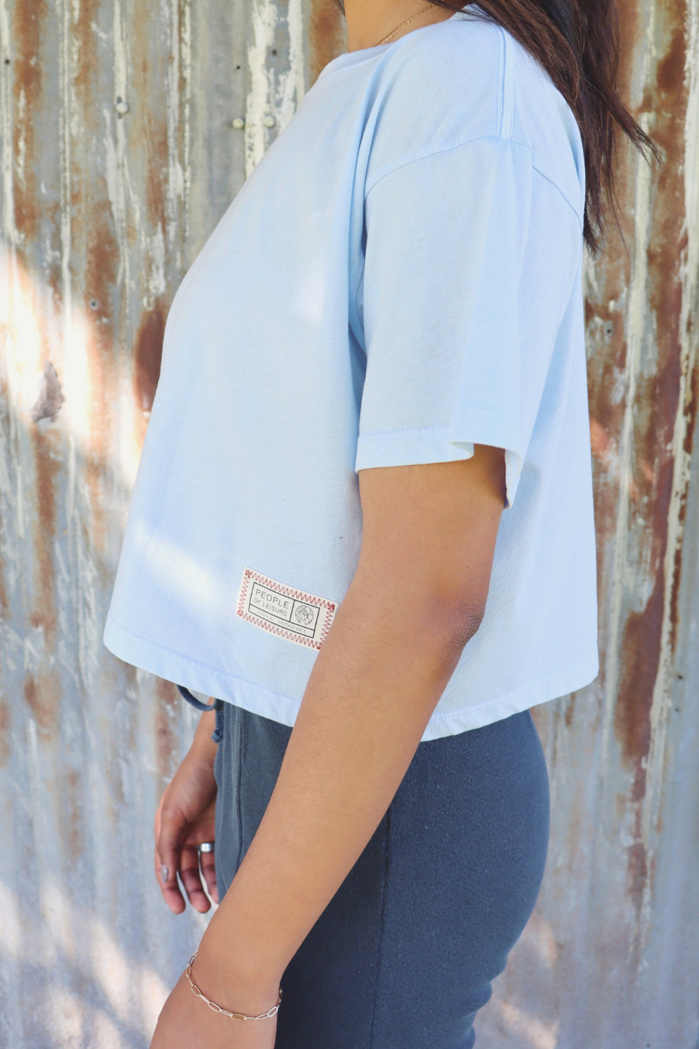 A lightweight boxy cropped t-shirt in Sky Blue and Apricot, showcasing its relaxed fit and eco-friendly fabric.