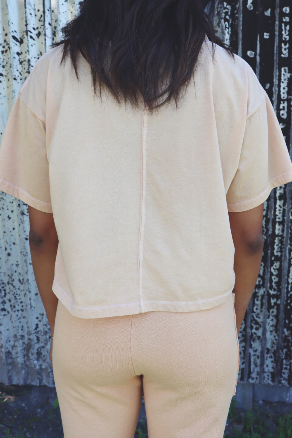 A lightweight boxy cropped t-shirt in Sky Blue and Apricot, showcasing its relaxed fit and eco-friendly fabric.