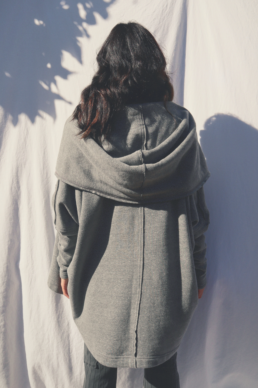 Cozy Big Sur Cardigan with oversized hoodie and pockets in black and heather grey, perfect for outdoor adventures.