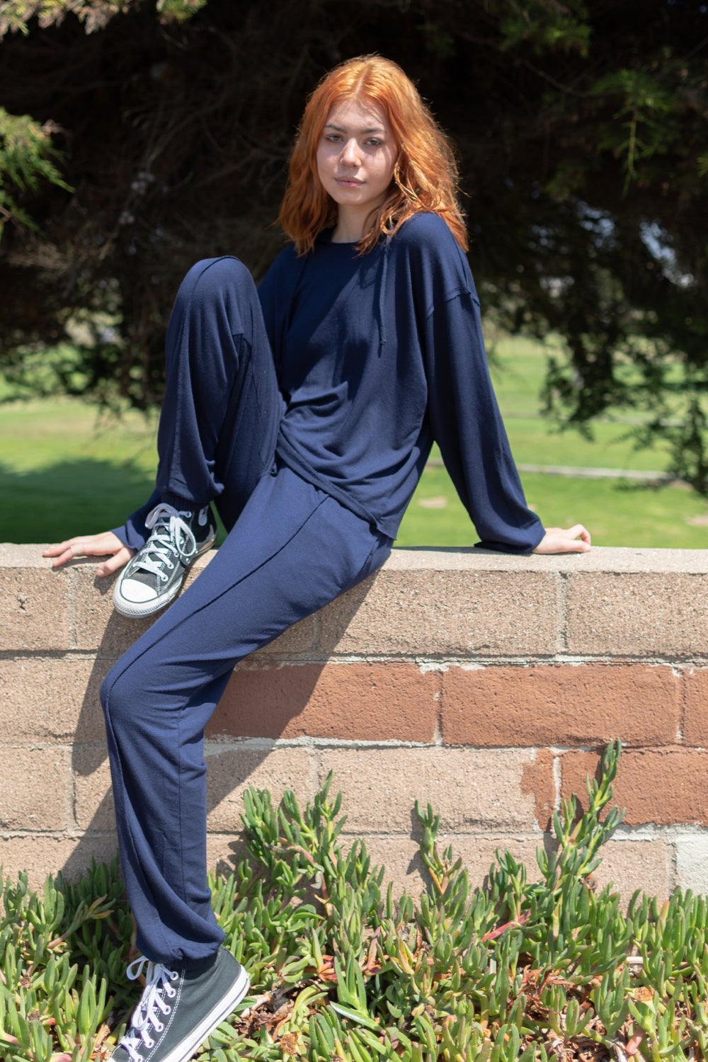 The Boxy Set featuring a cozy cropped hoodie and joggers with raw hems and stitching, made from organic cotton blend.