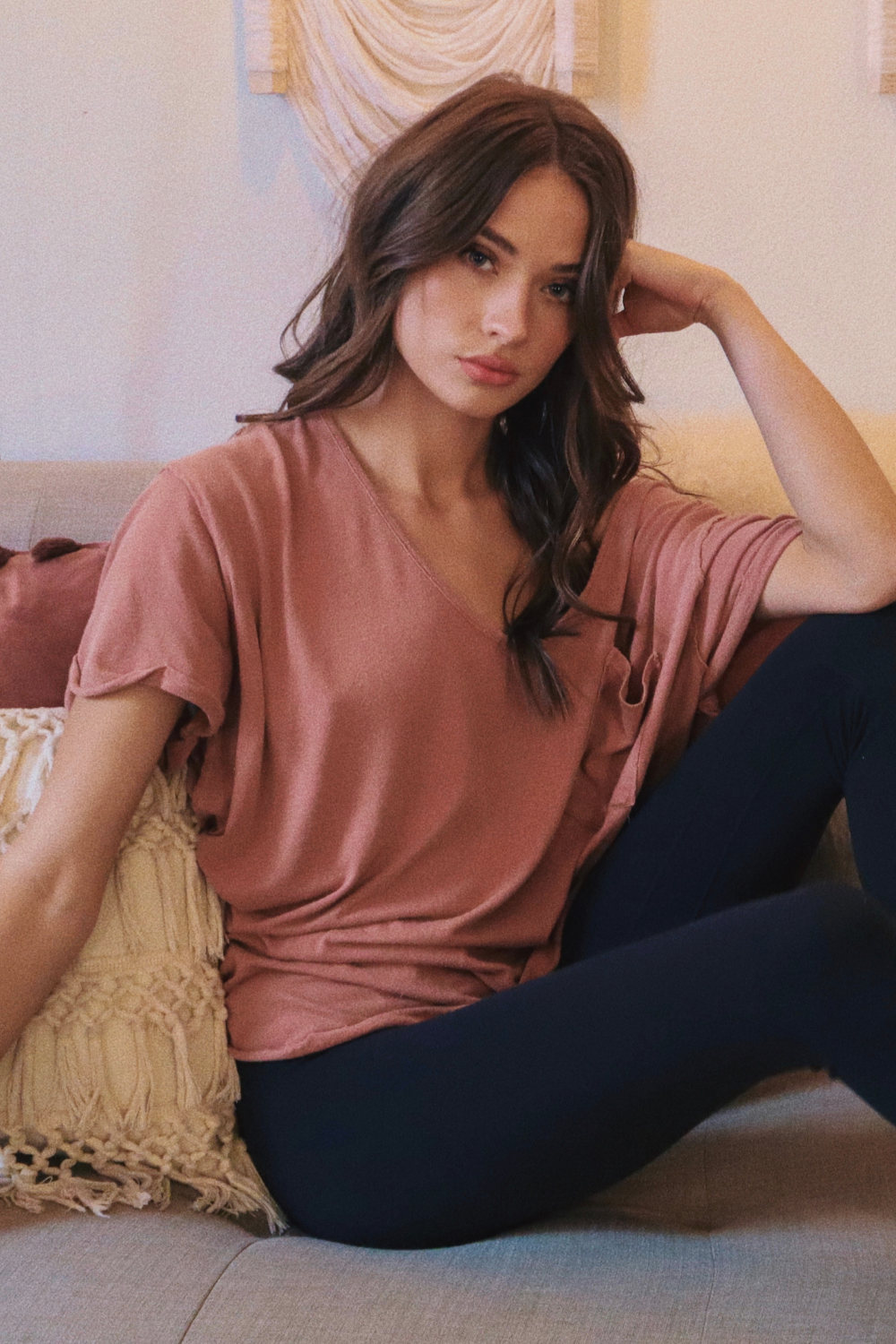 The Carli oversized slouchy tee in pink, featuring a pocket, rolled sleeves, and a back seam detail.