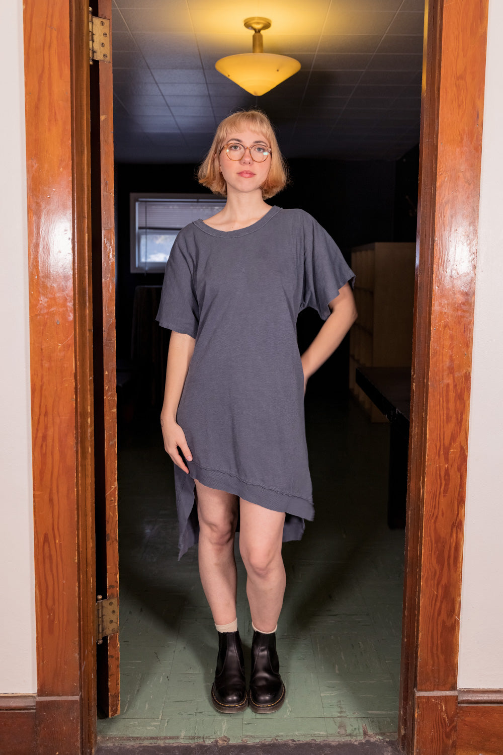 The Claire Dress in various colors, showcasing its flowing design and organic cotton fabric, perfect for any occasion.