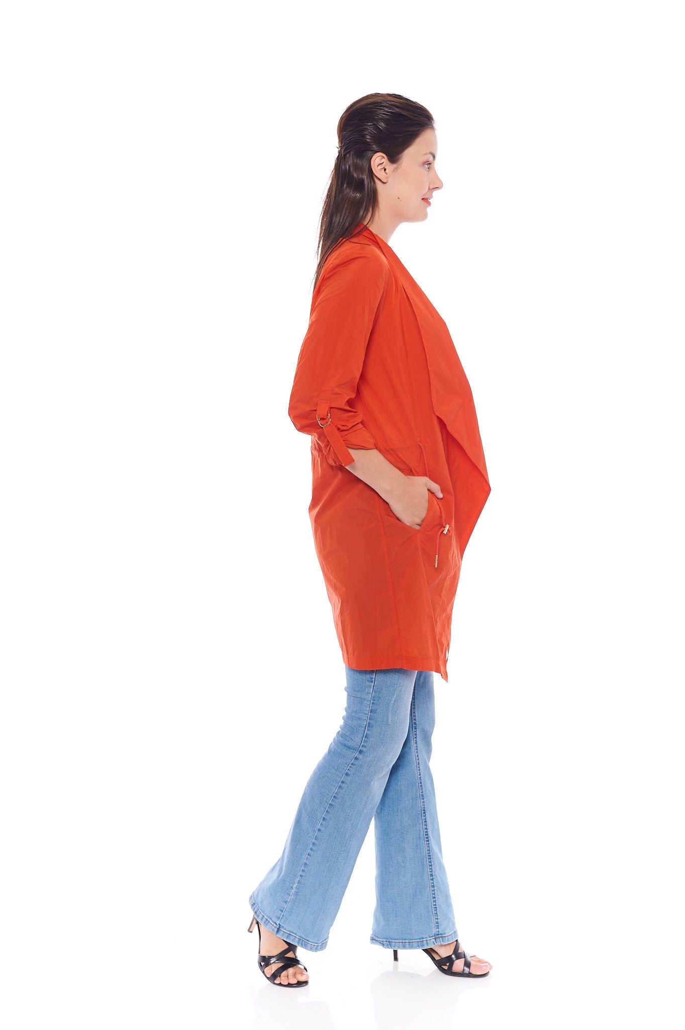 The Coral Turndown Jacket in Tangy Orange featuring stylish long sleeves and button details, perfect for summer wear.