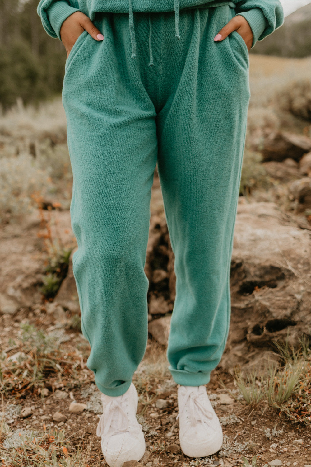 The Daybreak Joggers 3.0 in various colors, showcasing a fitted high-waist and tight ankle design, made from 100% cotton.