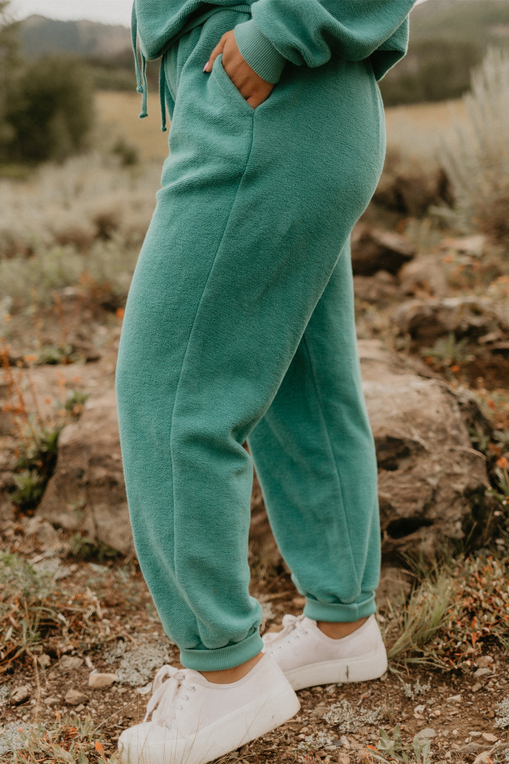 The Daybreak Joggers 3.0 in various colors, showcasing a fitted high-waist and tight ankle design, made from 100% cotton.