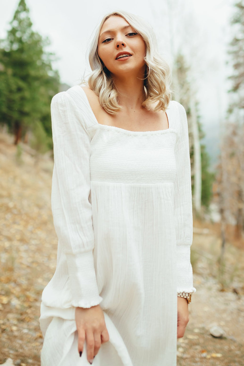 The Eleanor Dress featuring long sleeves, square neckline, and straight skirt in white organic cotton.