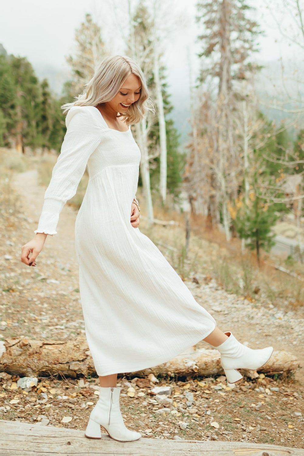 The Eleanor Dress featuring long sleeves, square neckline, and straight skirt in white organic cotton.