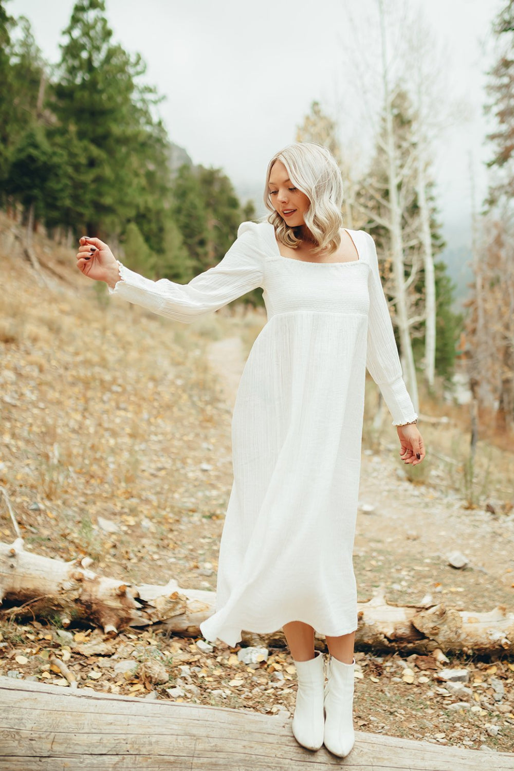 The Eleanor Dress featuring long sleeves, square neckline, and straight skirt in white organic cotton.