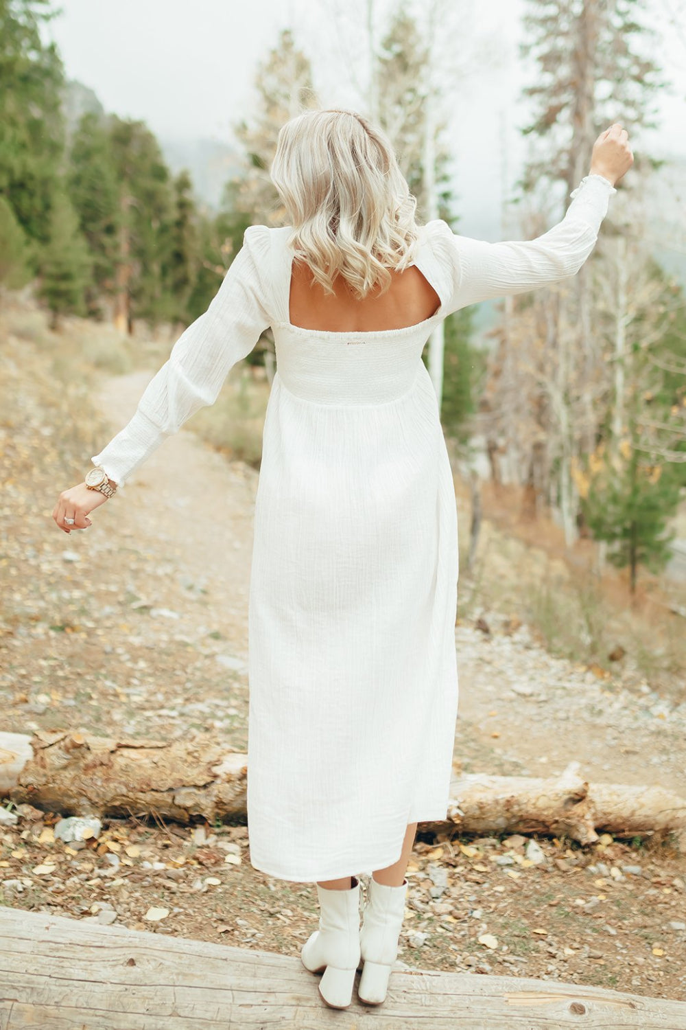 The Eleanor Dress featuring long sleeves, square neckline, and straight skirt in white organic cotton.