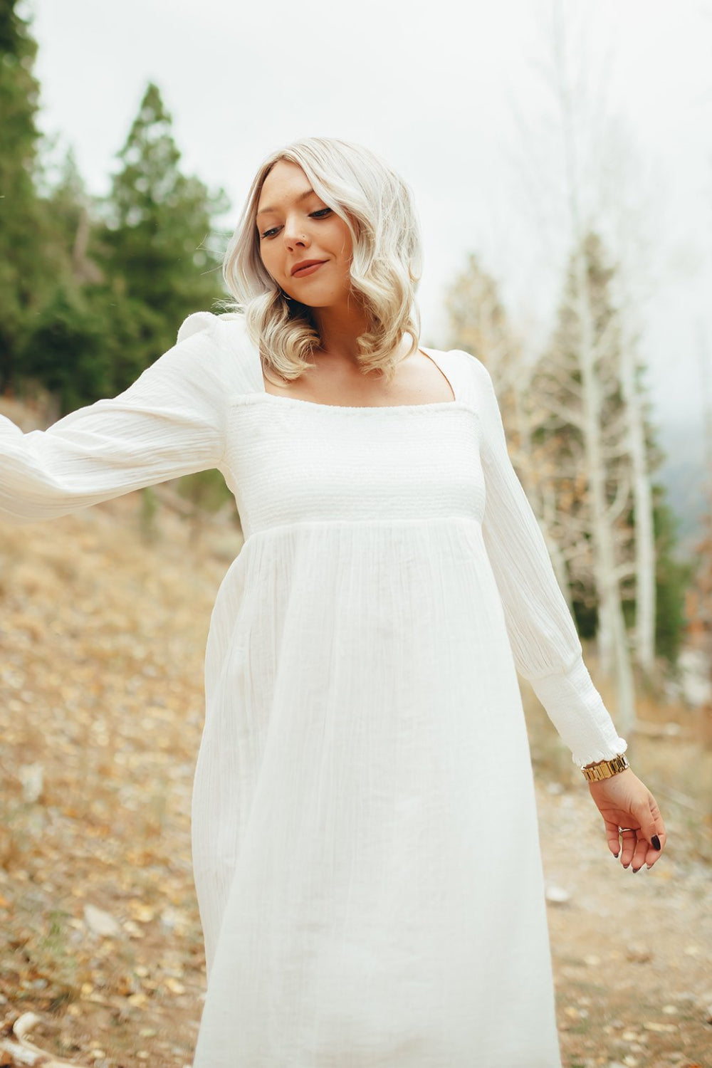 The Eleanor Dress featuring long sleeves, square neckline, and straight skirt in white organic cotton.