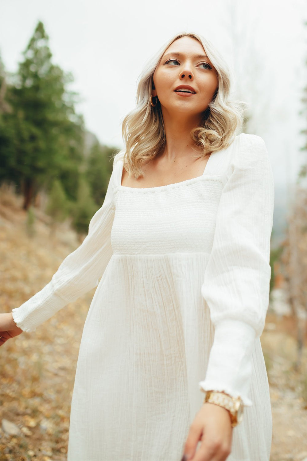 The Eleanor Dress featuring long sleeves, square neckline, and straight skirt in white organic cotton.