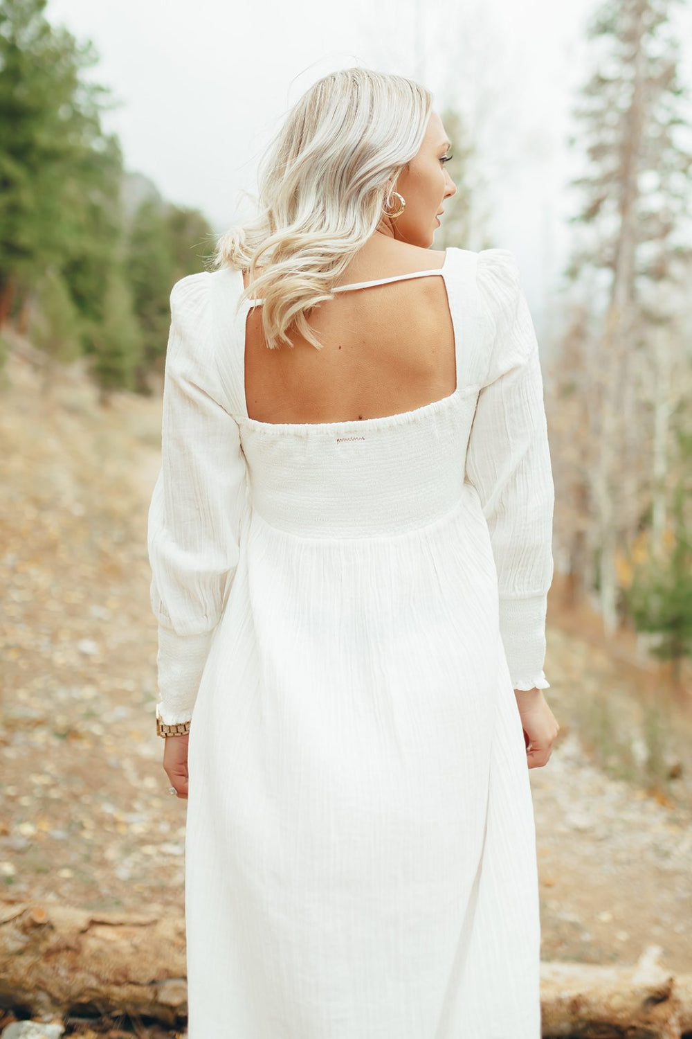 The Eleanor Dress featuring long sleeves, square neckline, and straight skirt in white organic cotton.