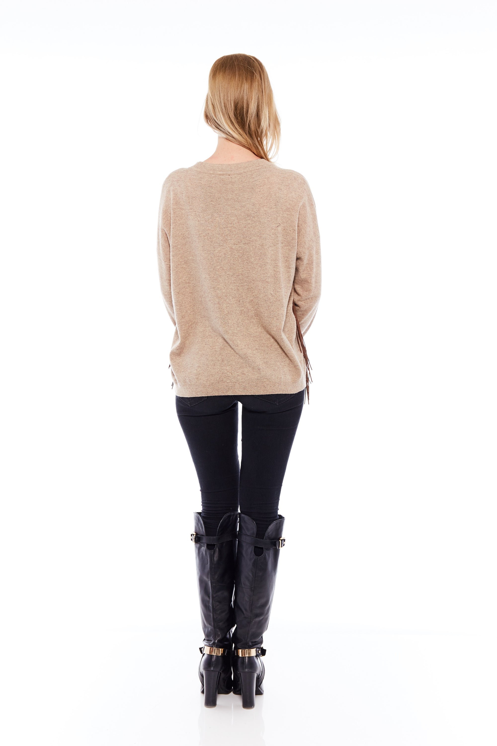 The Elevate Happy Hour Sweater in Classic Beige featuring long sleeves and leather tassels, perfect for stylish comfort.