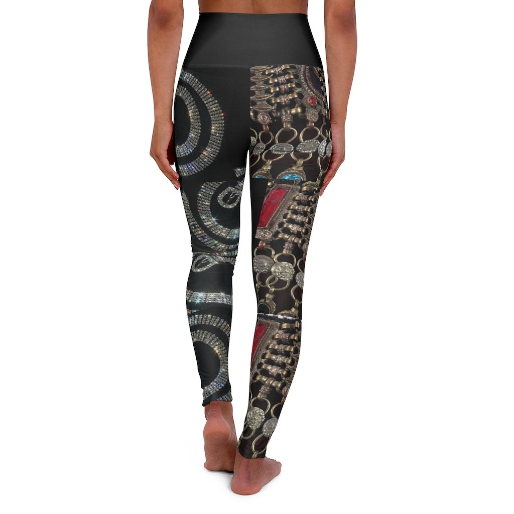 High-waisted skinny fit yoga leggings in black with double layer waistband and color-matched seams.