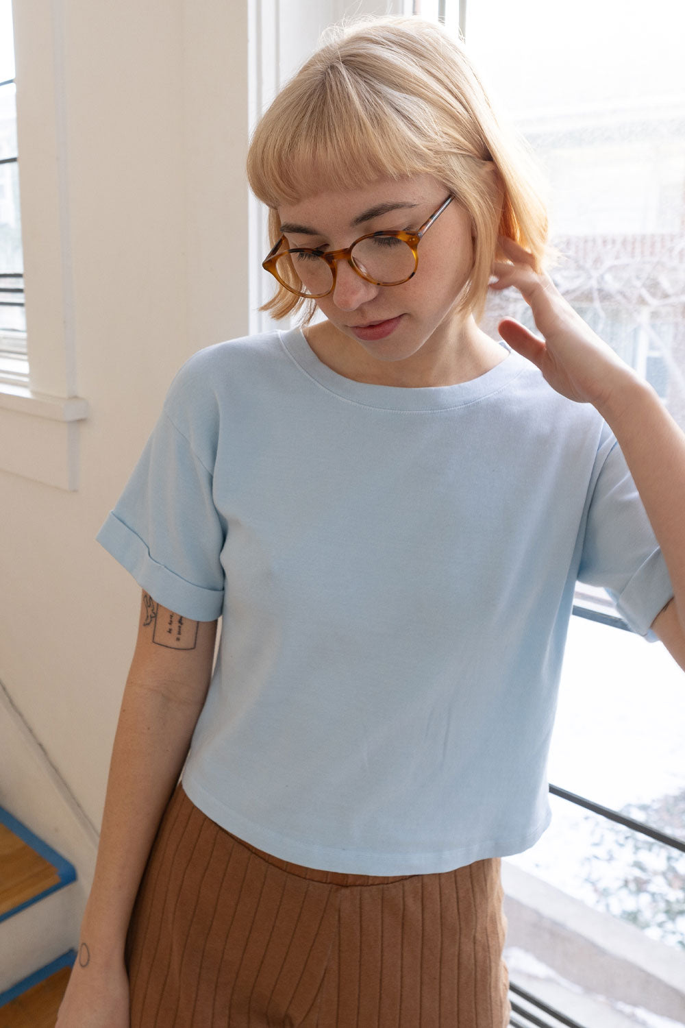 The Favorite Tee in organic cotton with rolled-up sleeves, showcasing a stylish and casual design.