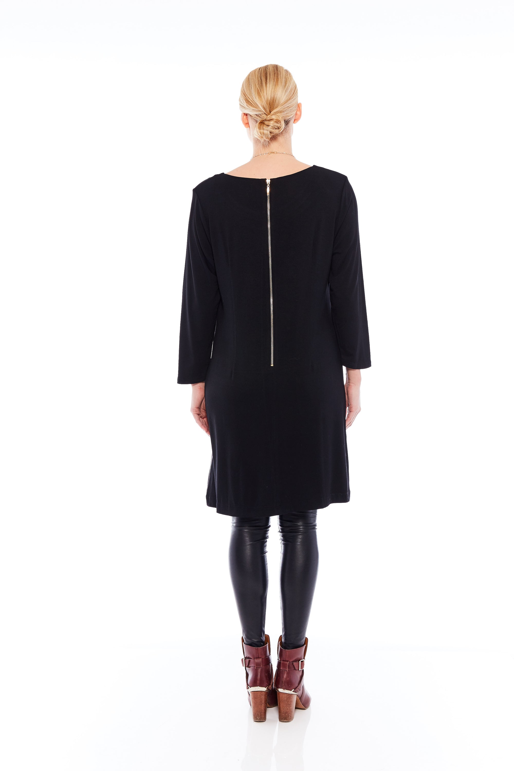 The Feel Good Dress in Matte Black featuring a soft fabric, long sleeves, and a stylish cowl neck, perfect for various occasions.