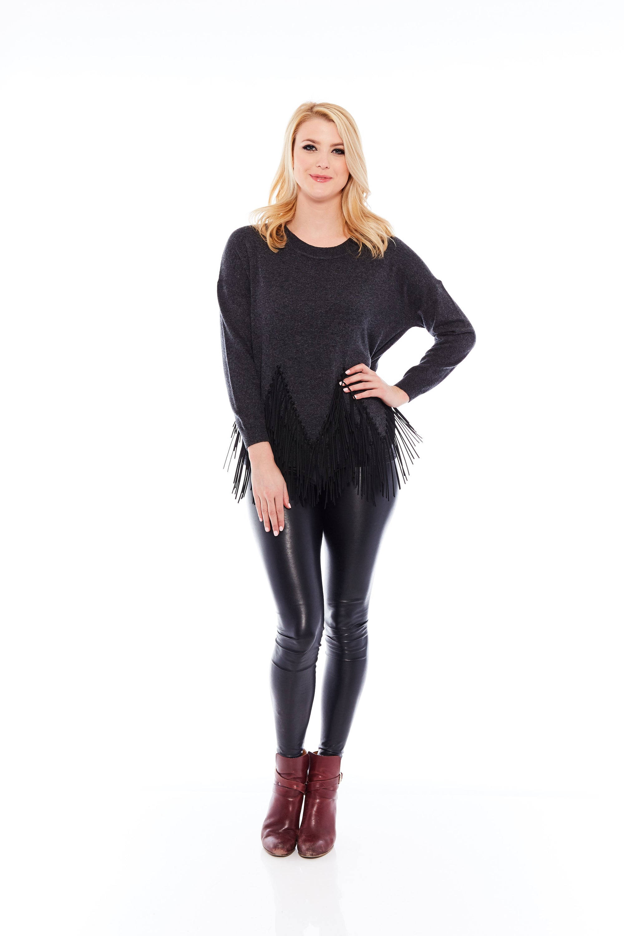 A stylish charcoal black sweater featuring leather tassels, showcasing a soft brushed fabric and a round neck design, perfect for casual and office wear.