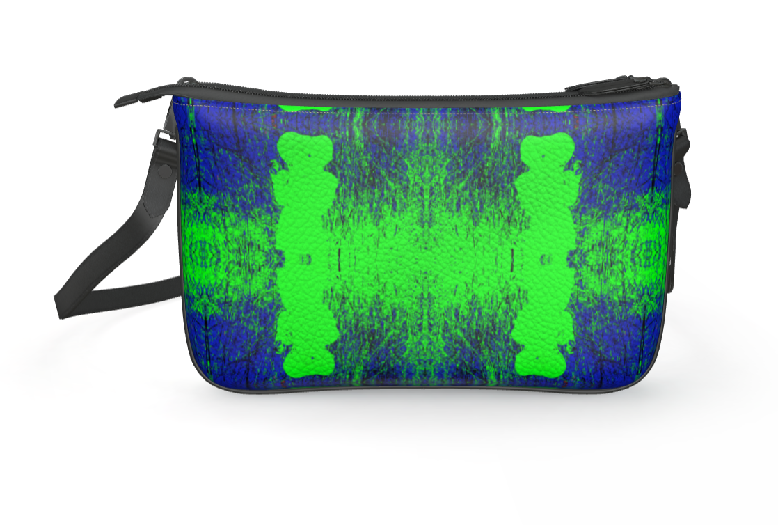 The Joel Green Shoulder Bag made of premium Nappa leather featuring a vibrant art print design, showcasing its foldover style and magnetic closures.