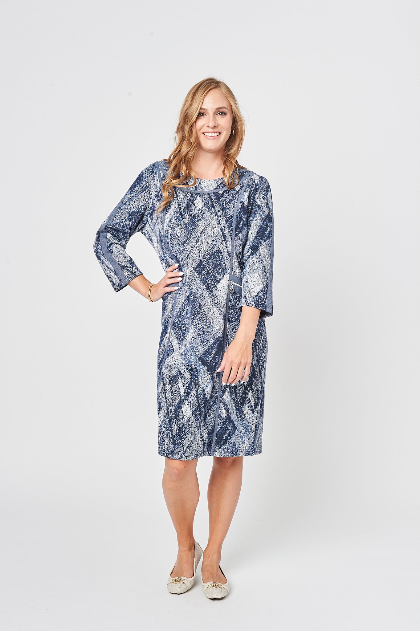 A cozy oversized dress in whitish blue with 3/4 sleeves and a double layer crew neck, perfect for casual wear.