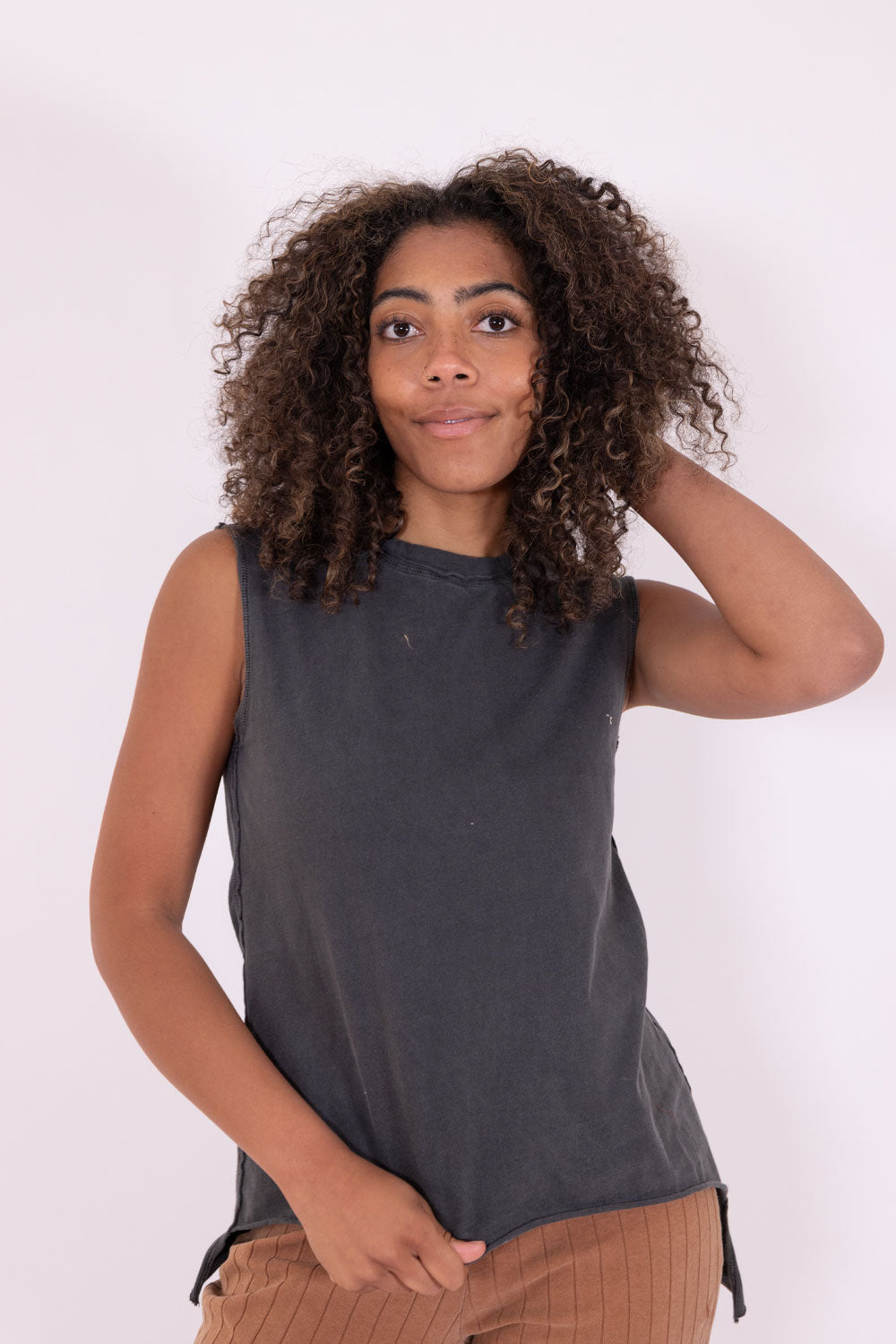 The Margo Tank, a vintage-inspired organic cotton tank top with exaggerated seams and distressed hems, showcasing a relaxed fit.