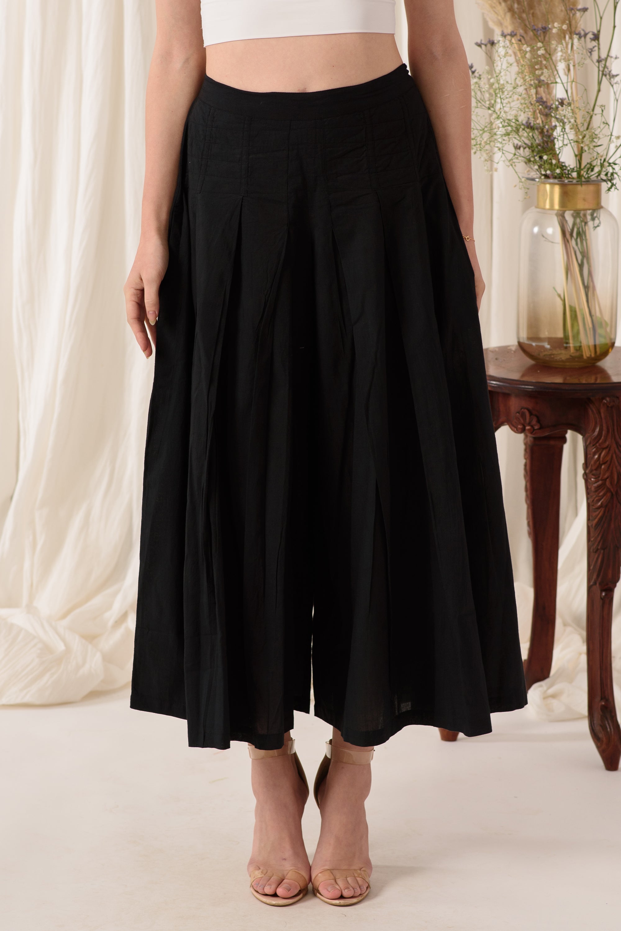 Stylish high-waisted flared pants in midnight black, showcasing a soft fabric and flattering silhouette.