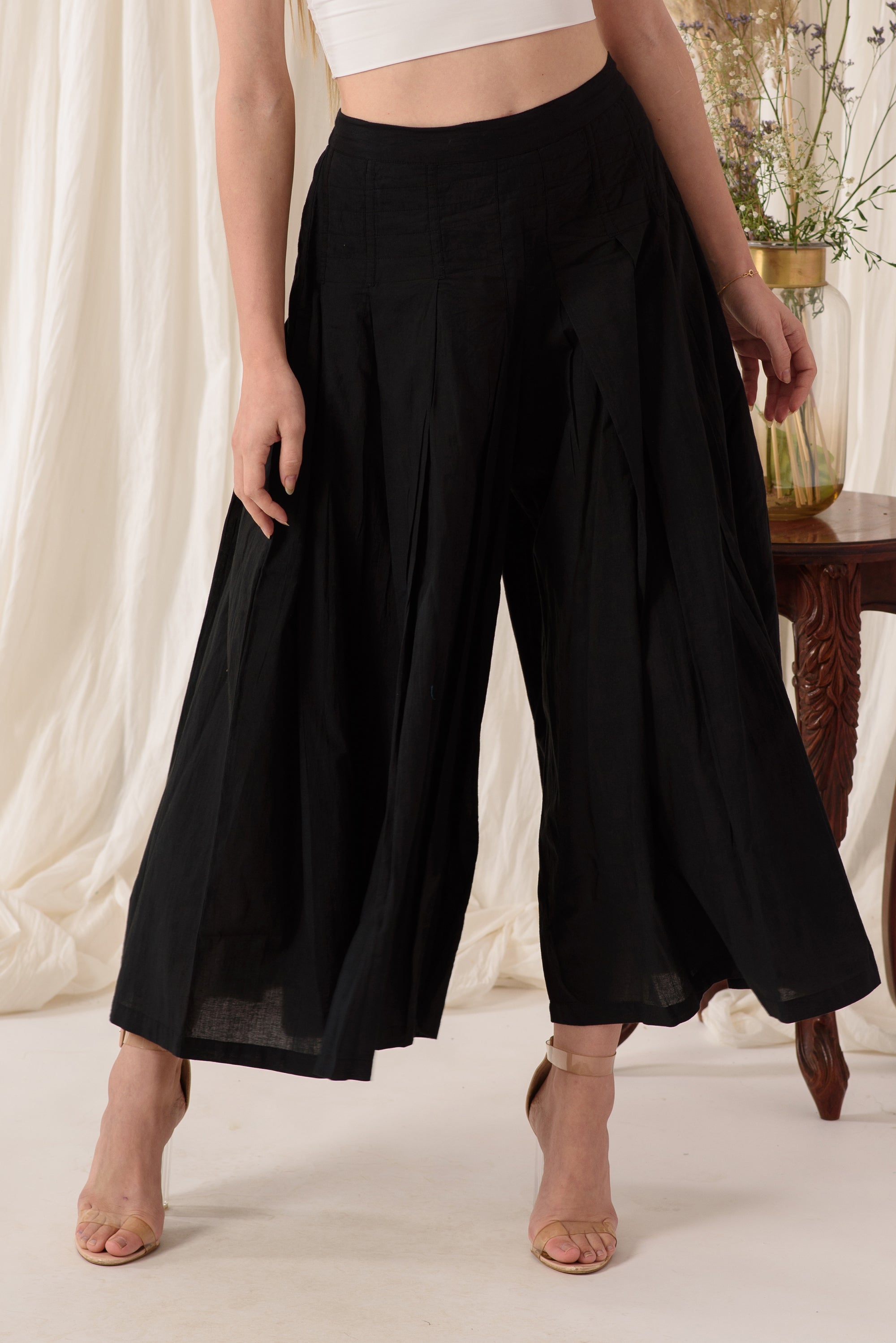 Stylish high-waisted flared pants in midnight black, showcasing a soft fabric and flattering silhouette.