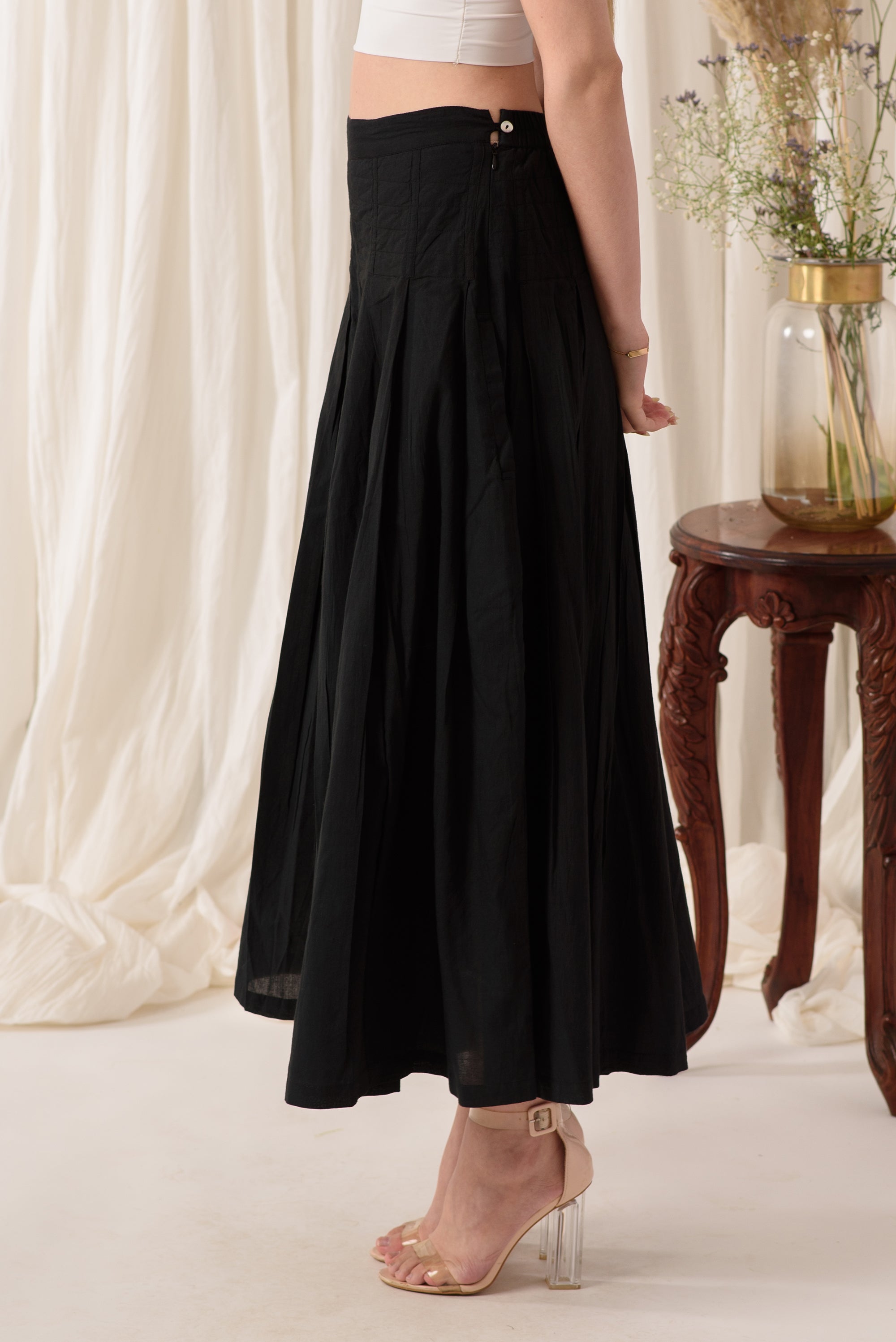 Stylish high-waisted flared pants in midnight black, showcasing a soft fabric and flattering silhouette.