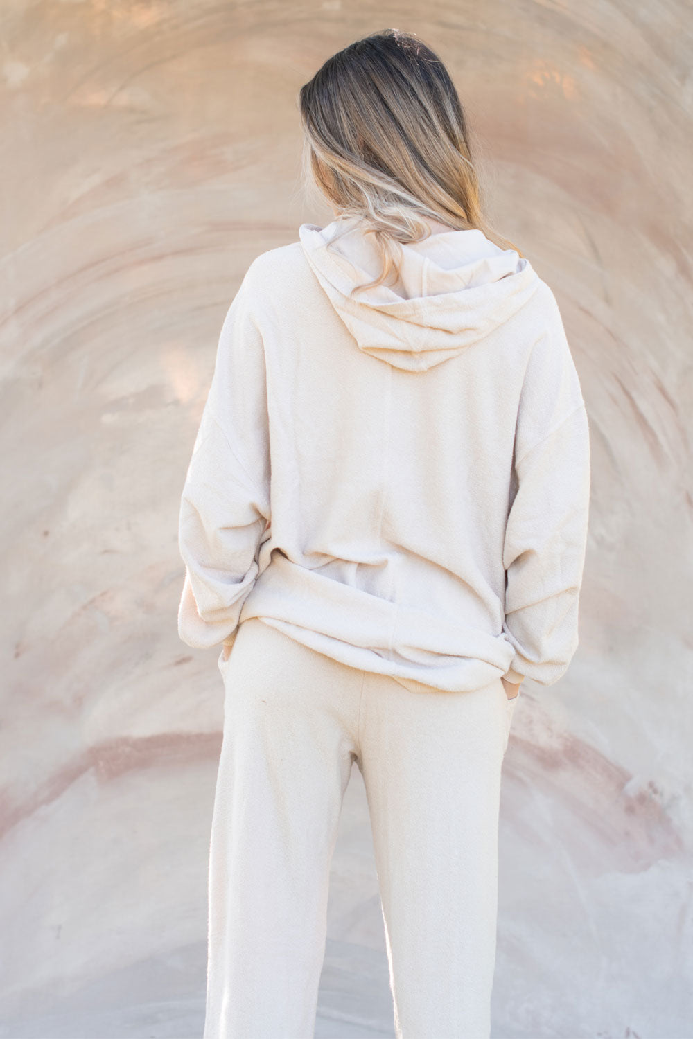 The New 90’s Set oversized hoodie in Rose, Ivory, and Vintage Black, showcasing its relaxed fit and stylish design.