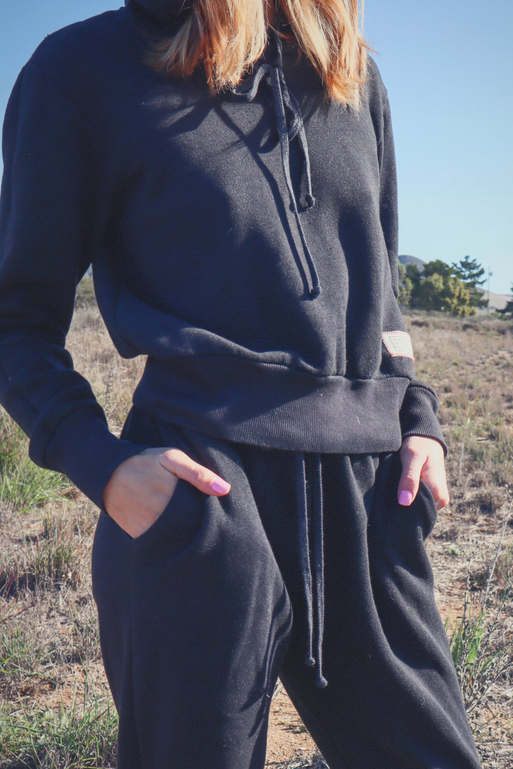 The New Daybreak Hoodie in black, showcasing its relaxed fit and vintage-inspired design, perfect for casual wear.