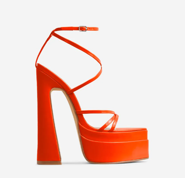 The Orange Gelica Platform featuring red patent material, strappy detailing, pointed toe, and extreme block heel.