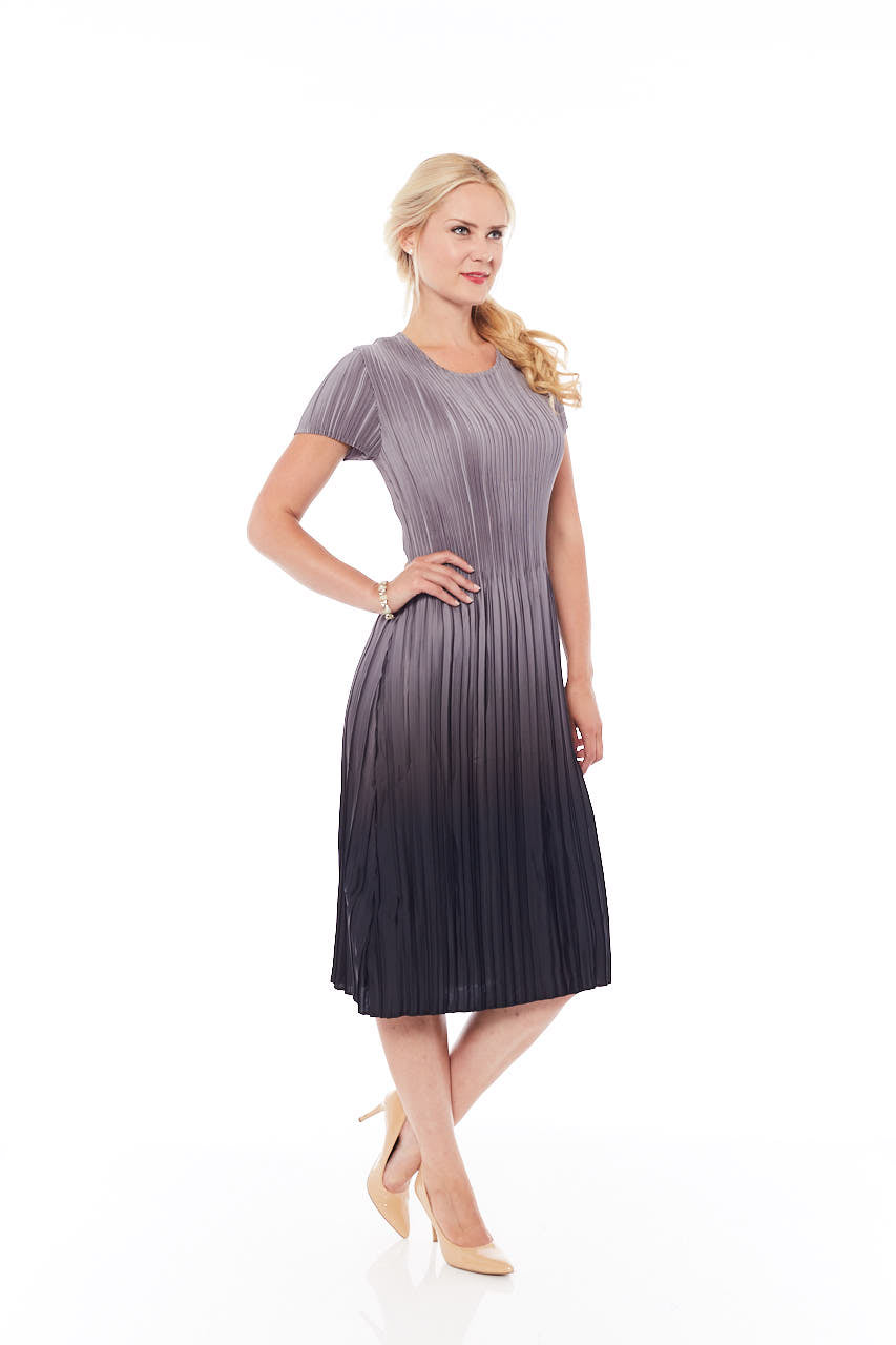 A stylish Pleated Gradient Dress in Mousy Grey, featuring a loose-fit design and elegant pleats, perfect for spring occasions.