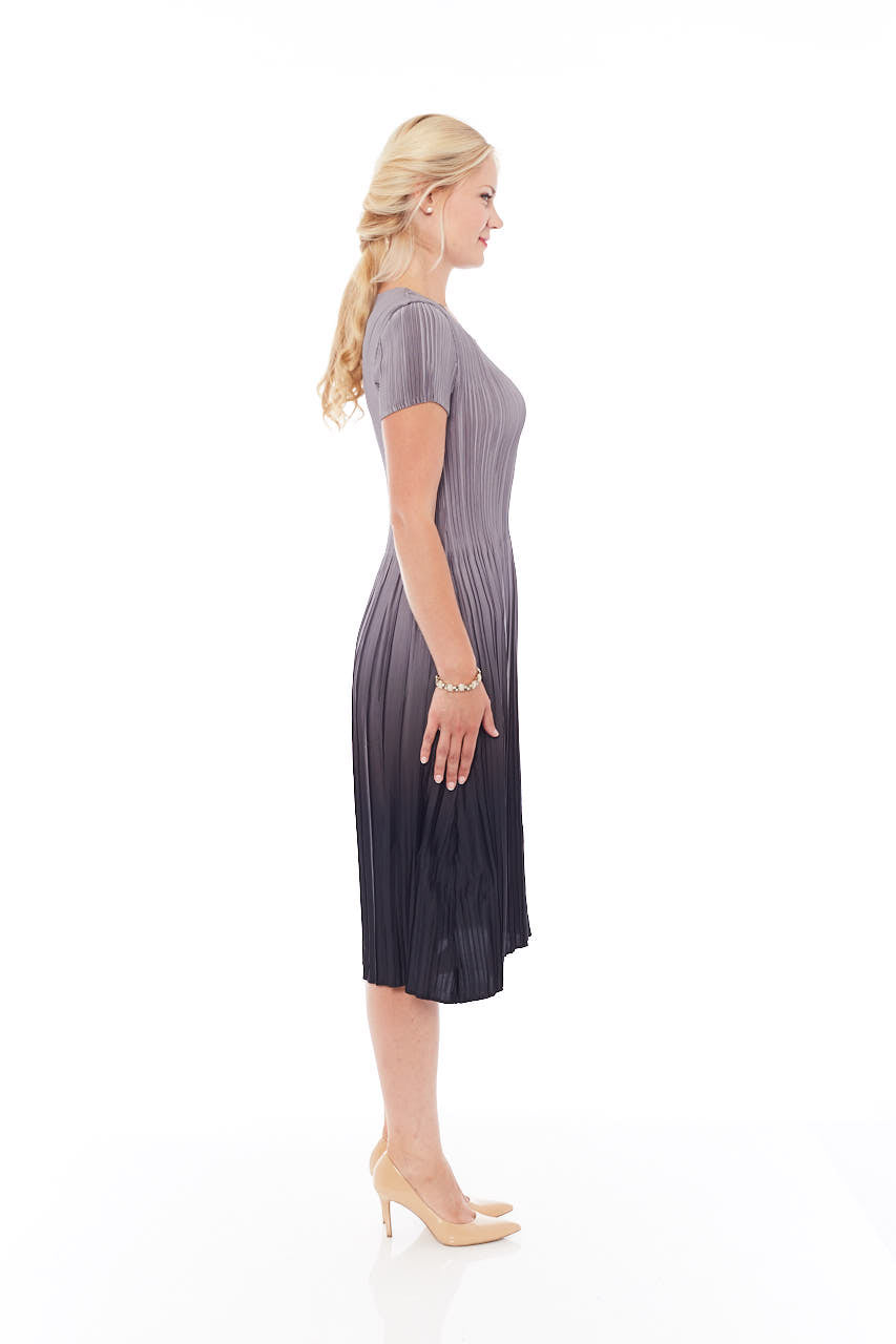 A stylish Pleated Gradient Dress in Mousy Grey, featuring a loose-fit design and elegant pleats, perfect for spring occasions.