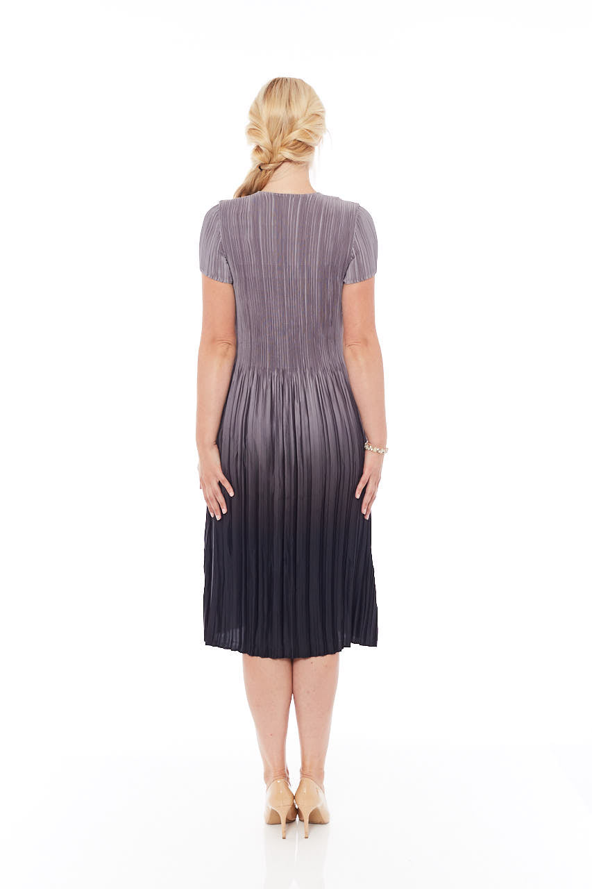 A stylish Pleated Gradient Dress in Mousy Grey, featuring a loose-fit design and elegant pleats, perfect for spring occasions.