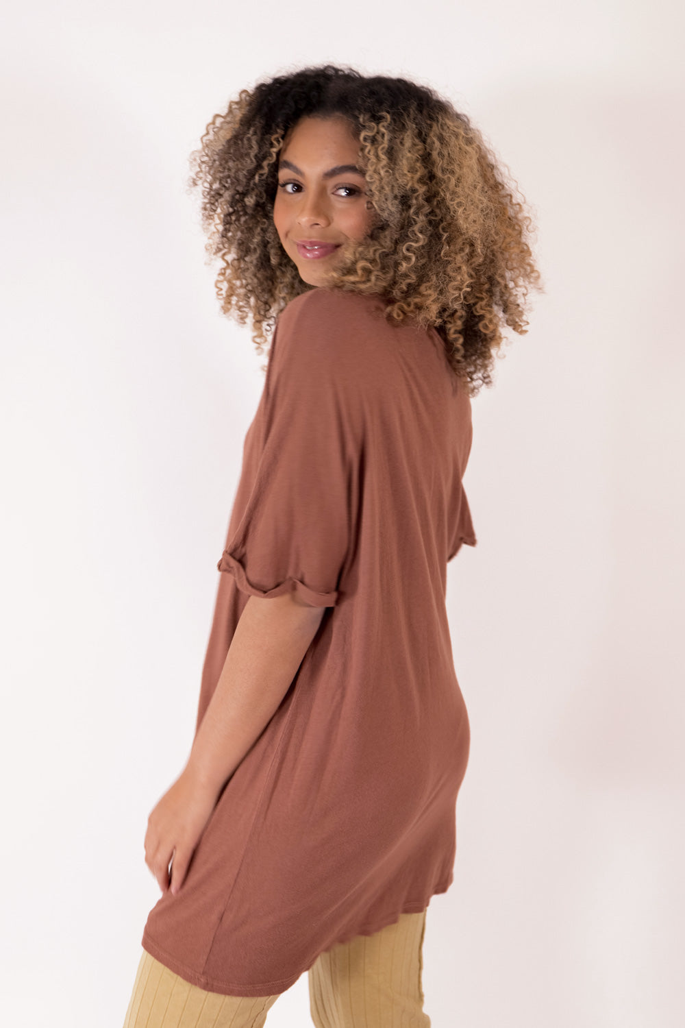 The Rocker Tee in an oversized slouchy silhouette, made from organic cotton and hemp, available in brown, black, and saddle colors.