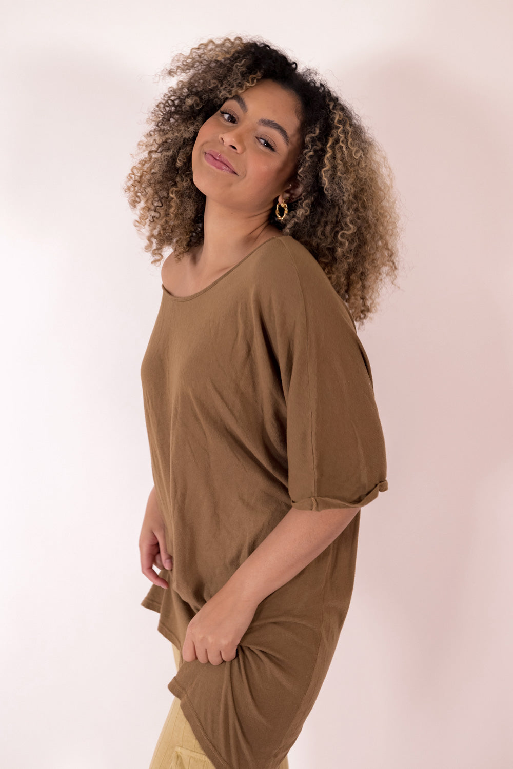 The Rocker Tee in an oversized slouchy silhouette, made from organic cotton and hemp, available in brown, black, and saddle colors.