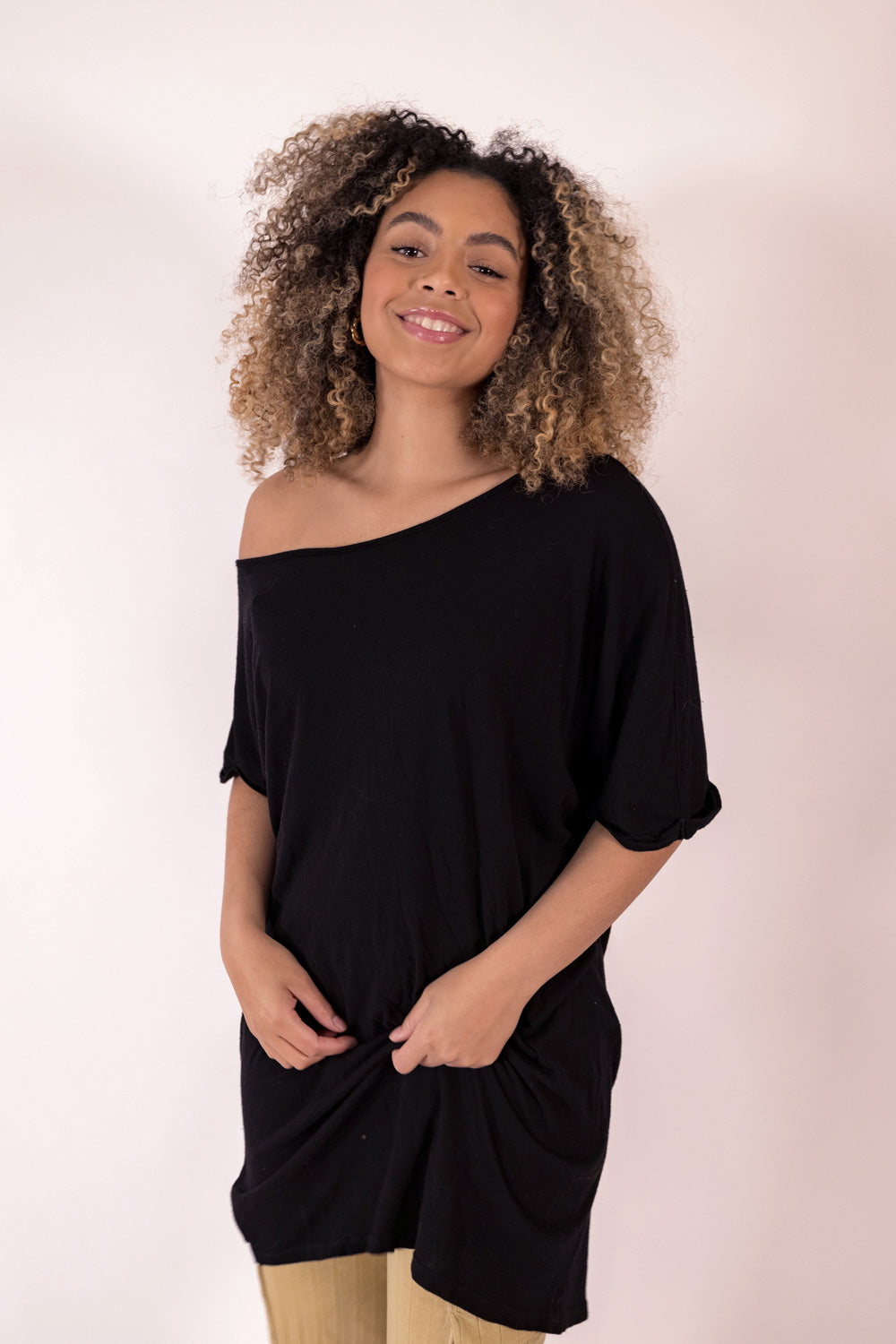 The Rocker Tee in an oversized slouchy silhouette, made from organic cotton and hemp, available in brown, black, and saddle colors.