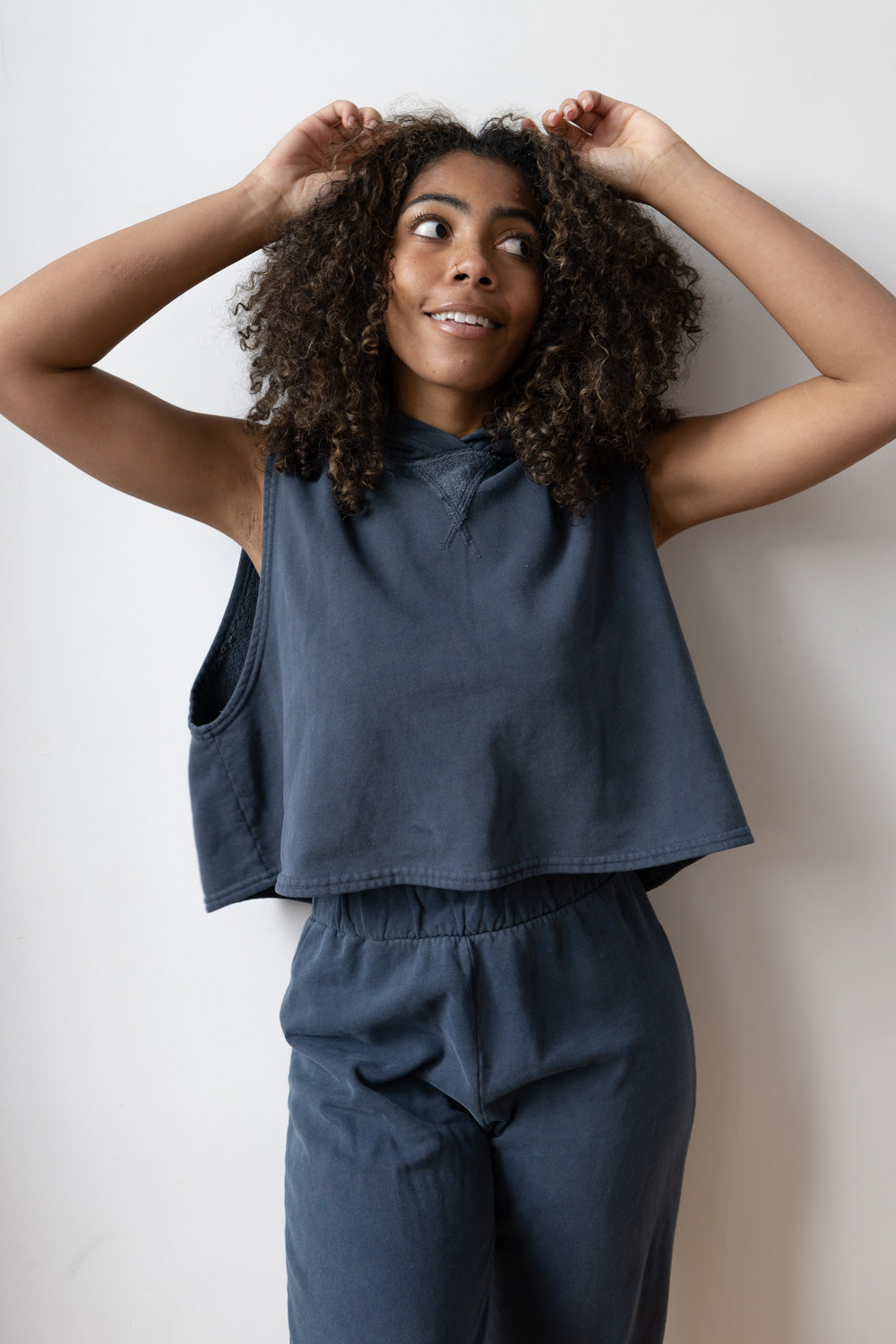 The Rocky Tee in dark blue and maroon, showcasing a cropped design with a soft crew neck and hoodie.