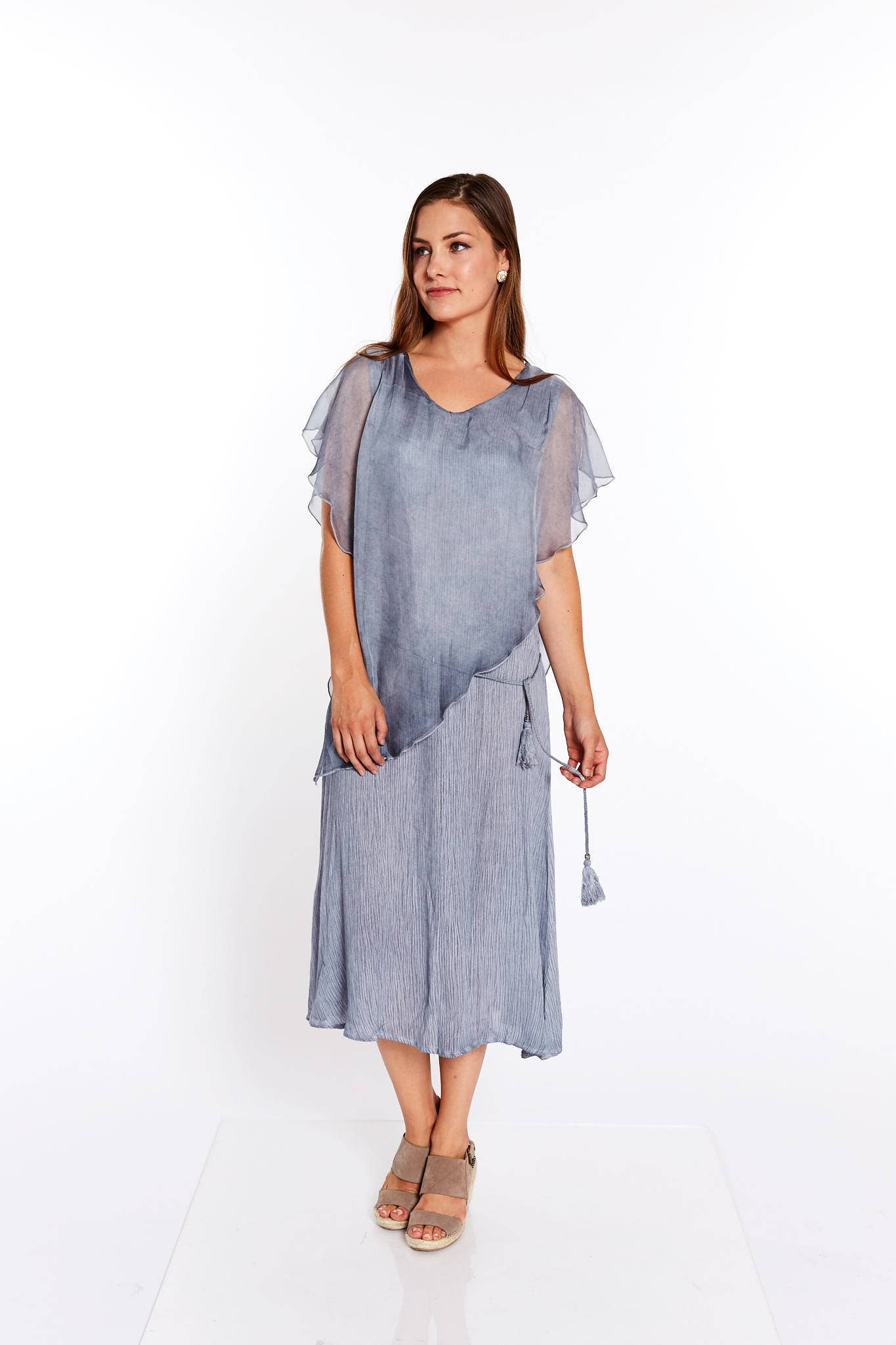 The Scoopy Flared Tassel Tied Dress in Pale Grey, featuring a soft fabric, flared silhouette, and layered sleeves, perfect for versatile styling.