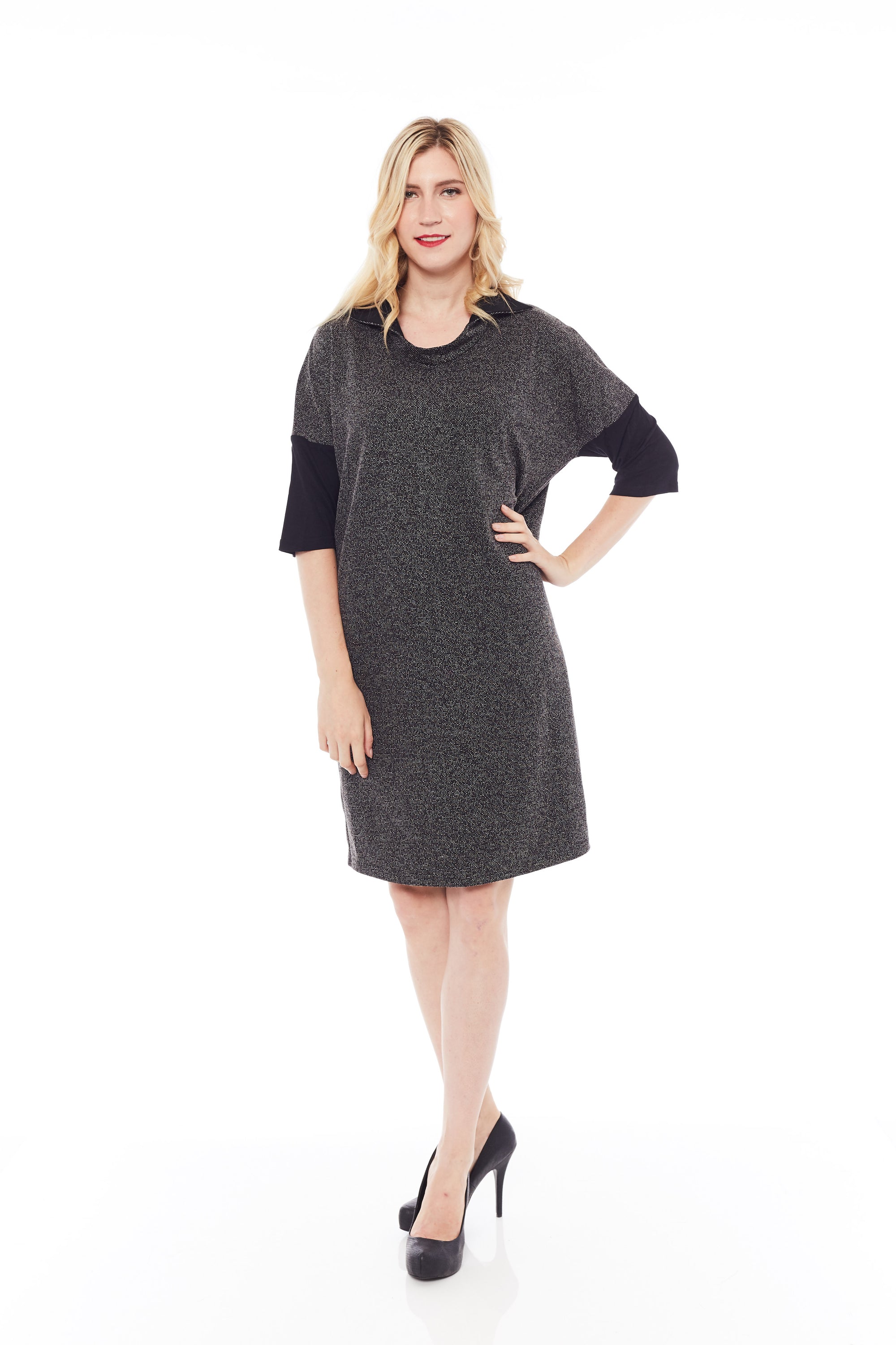 A stylish woman wearing the Shimmery Dress in Classic Black, showcasing its soft fabric and elegant design.