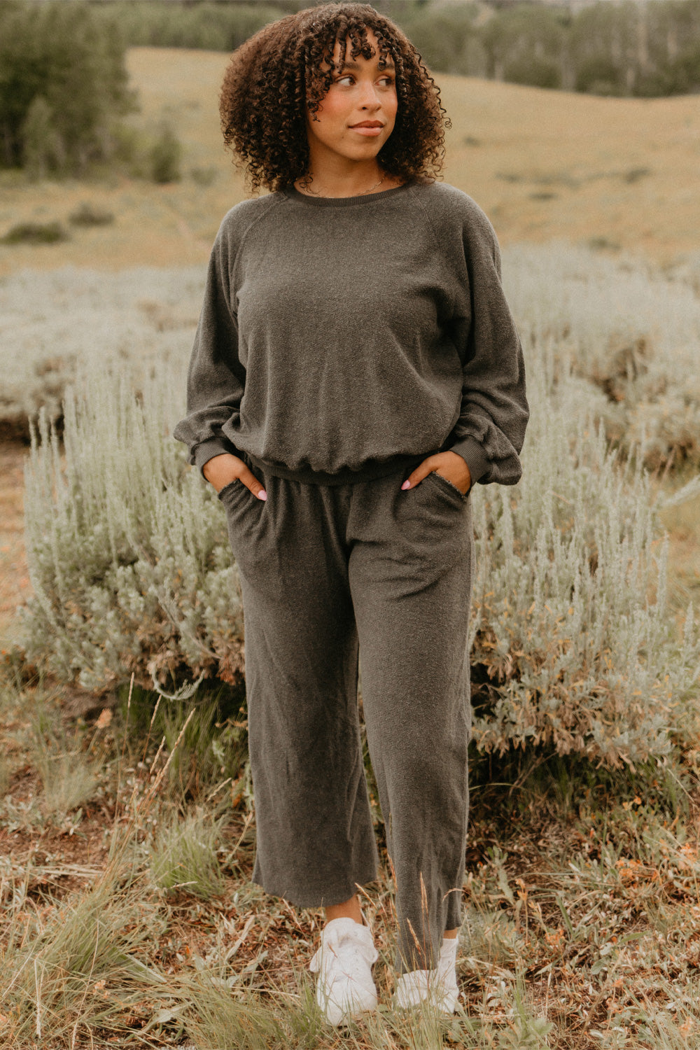 The Smile Sweatshirt in an oversized fit, featuring a feminine neckline and ribbed hems, made from 100% organic cotton.