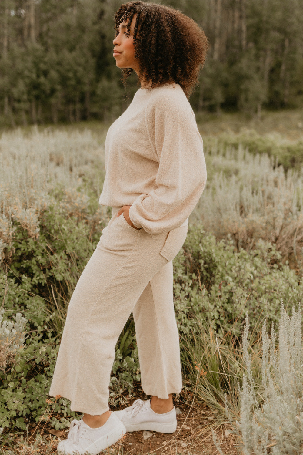 The Smile Sweatshirt in an oversized fit, featuring a feminine neckline and ribbed hems, made from 100% organic cotton.