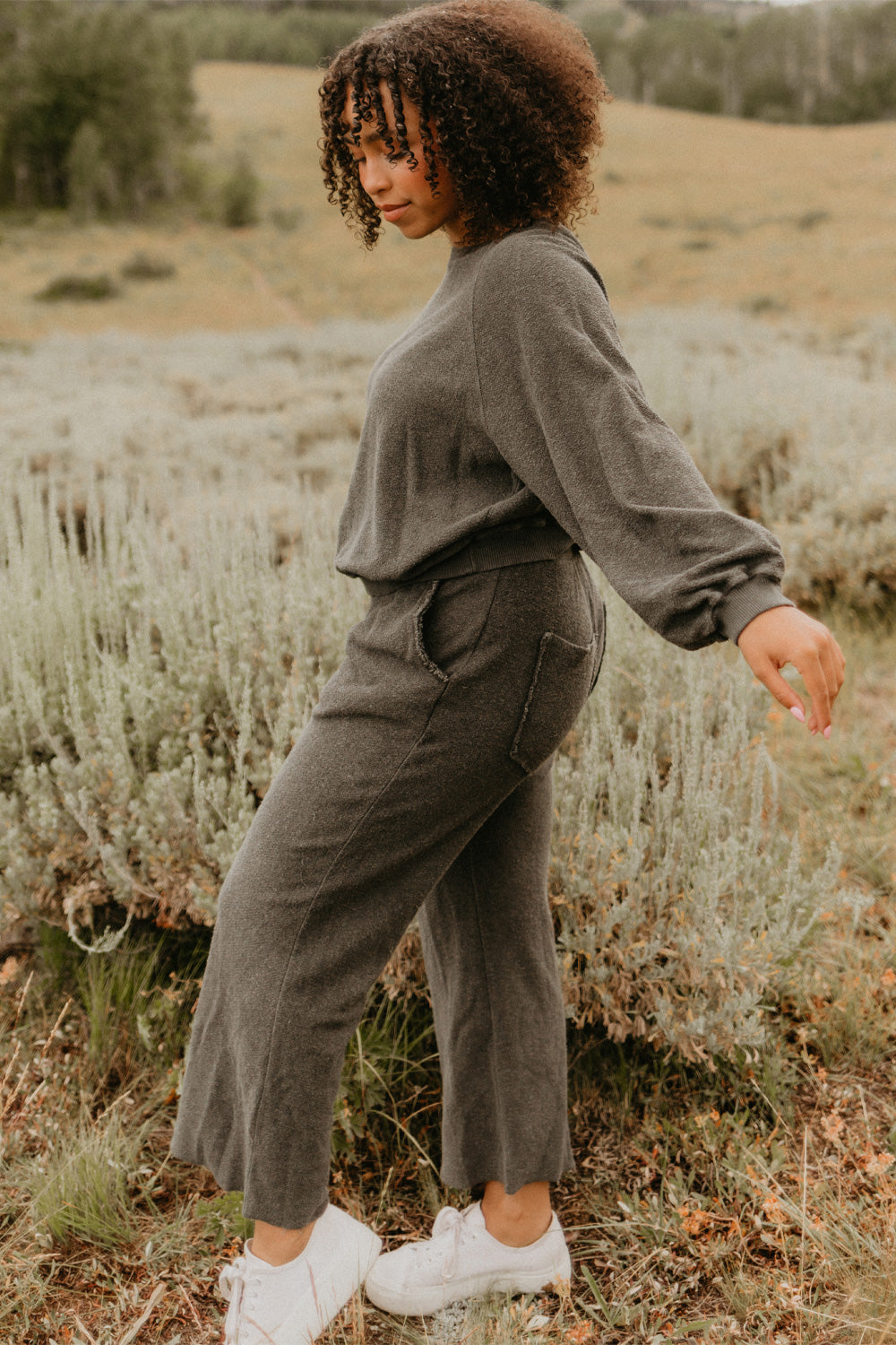 The Smile Sweatshirt in an oversized fit, featuring a feminine neckline and ribbed hems, made from 100% organic cotton.