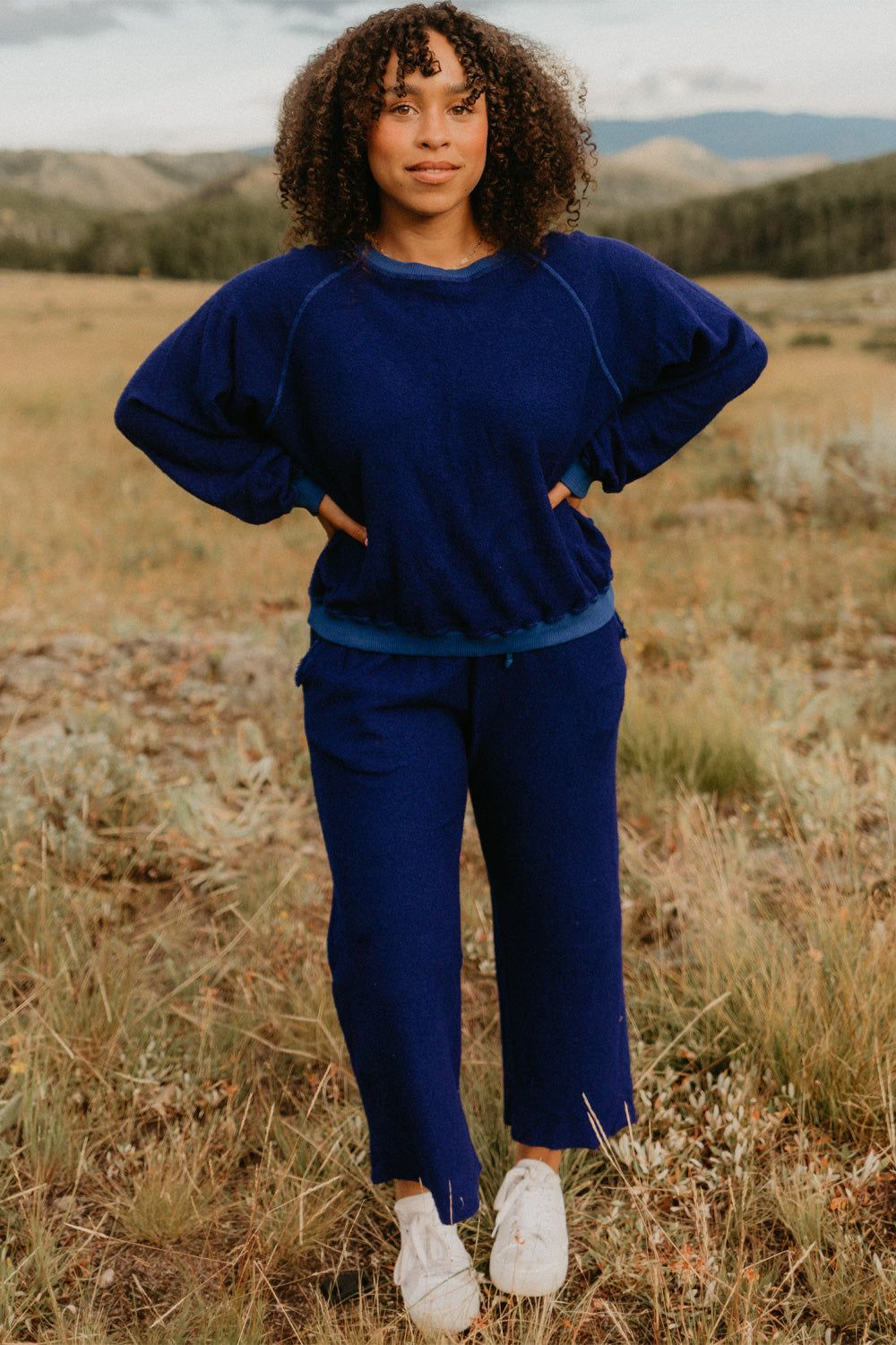 The Smile Sweatshirt in an oversized fit, featuring a feminine neckline and ribbed hems, made from 100% organic cotton.