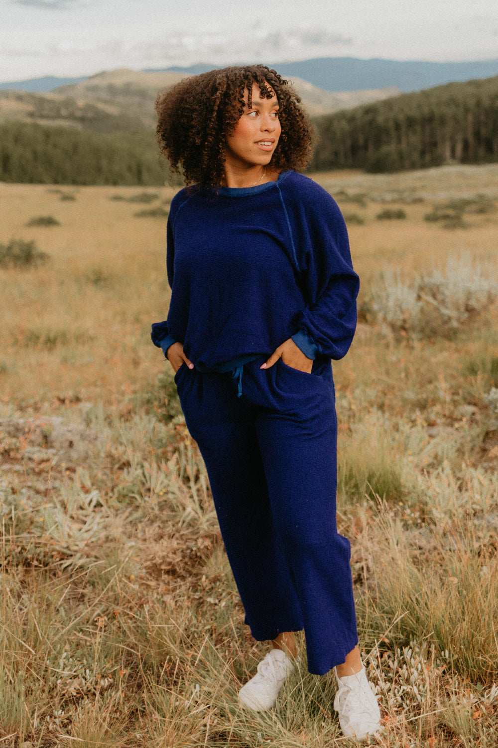 The Smile Sweatshirt in an oversized fit, featuring a feminine neckline and ribbed hems, made from 100% organic cotton.