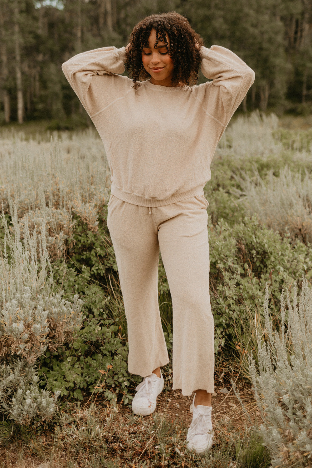 The Smile Sweatshirt in an oversized fit, featuring a feminine neckline and ribbed hems, made from 100% organic cotton.