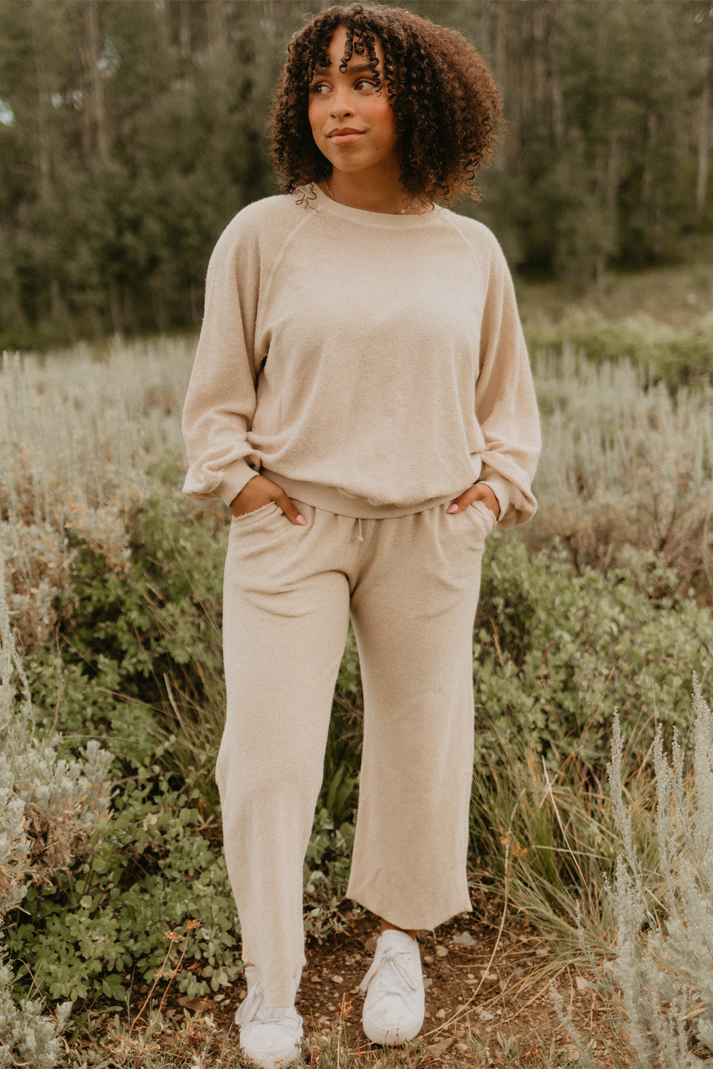 The Smile Sweatshirt in an oversized fit, featuring a feminine neckline and ribbed hems, made from 100% organic cotton.