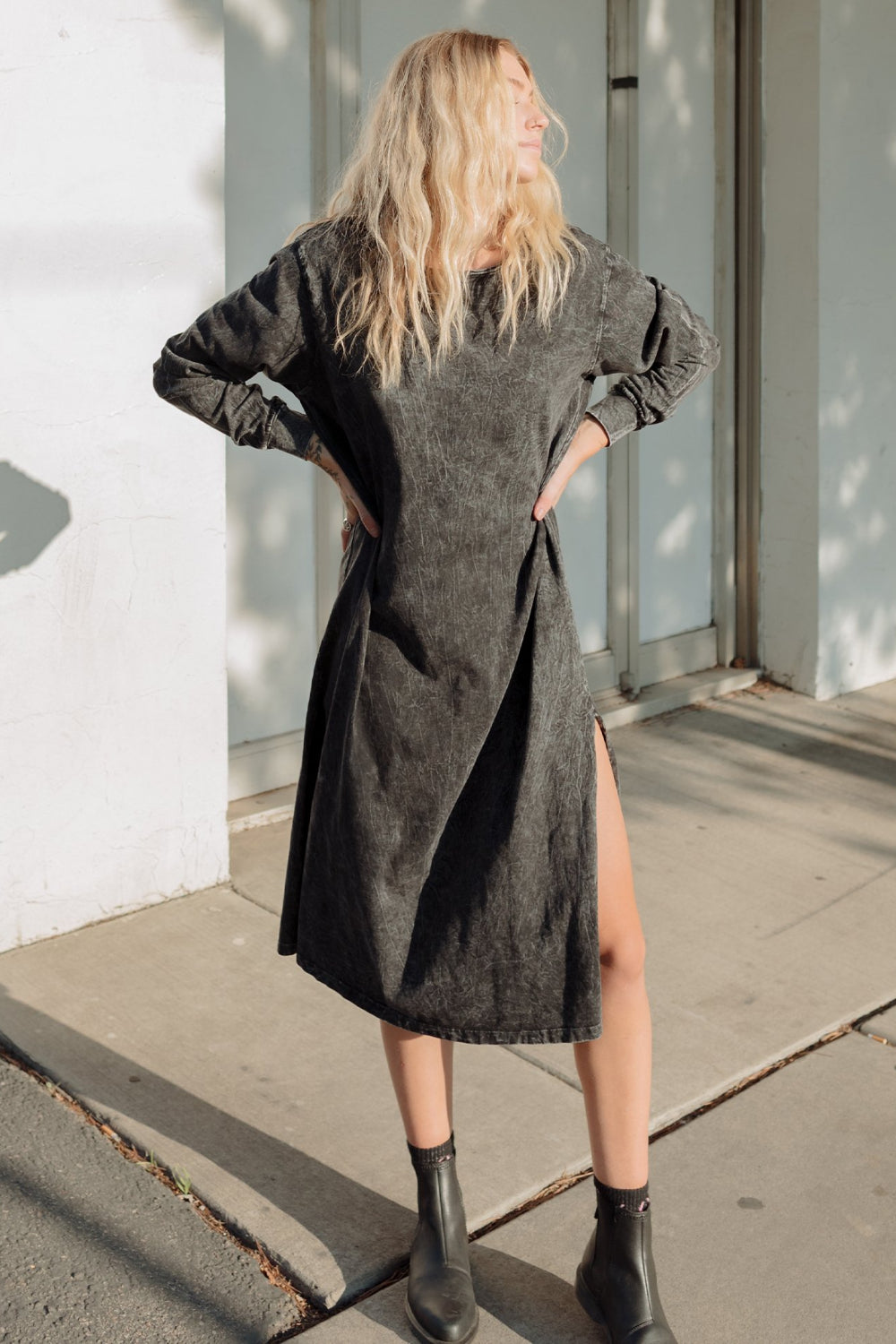 The Taylor Dress in four colors: Brown, Denim, Washed Black, and Peach, featuring long sleeves, a crew neck, and a slight hem slit.